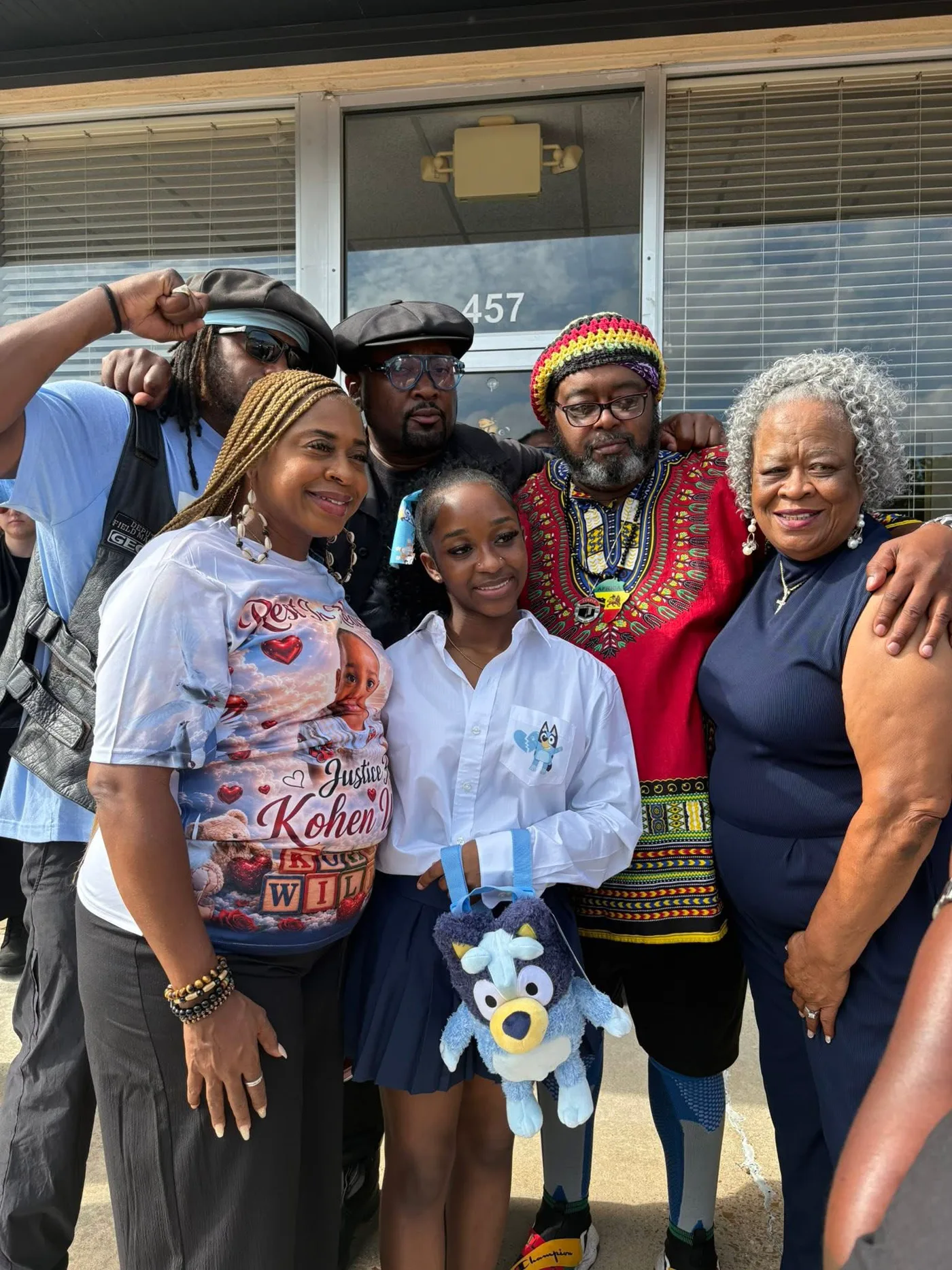 Family and community members standing together in Kohen’s memory